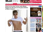 Justin Bieber levanta a camisa e exibe o abdômen