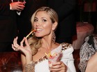 Heidi Klum devora batatas fritas na festa pós-Globo de Ouro