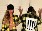 Beyoncé sensualiza em ensaio e posa sem sutiã, com camisa aberta