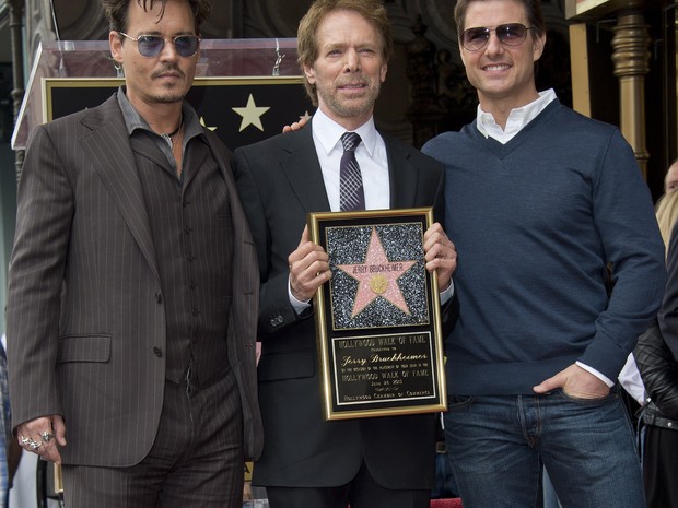 Johnny Depp, o produtor Jerry Bruckheimer e Tom Cruise em evento em Los Angeles, nos Estados Unidos (Foto: Robyn Beck/ AFP)