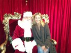 Em rede social, Heidi Klum posta foto ao lado de Papai Noel