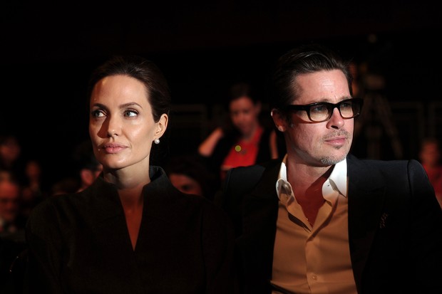 Angelina Jolie e Brad Pitt no Global Summit to End Sexual Violence in Conflict em Londres - Junho de 2014 (Foto: AFP)